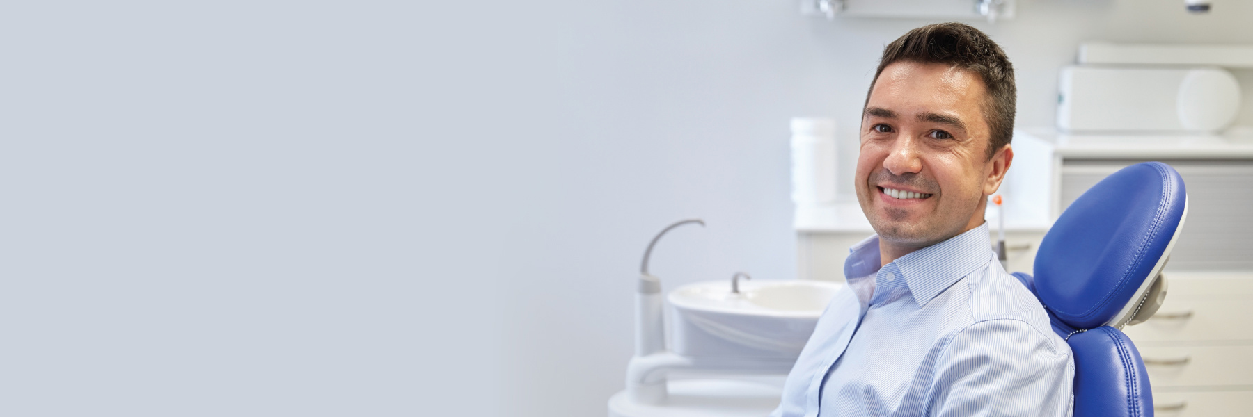 Patient seated in a dental treatment chair at a clinic in Pimpama